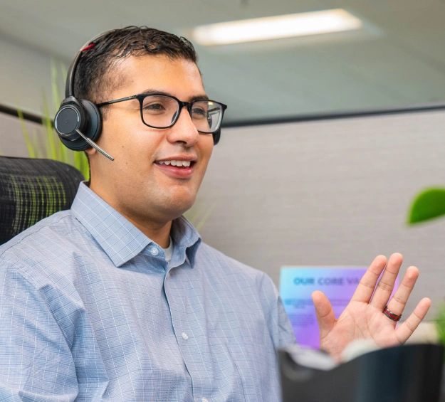 DentalQore employee talking to a client