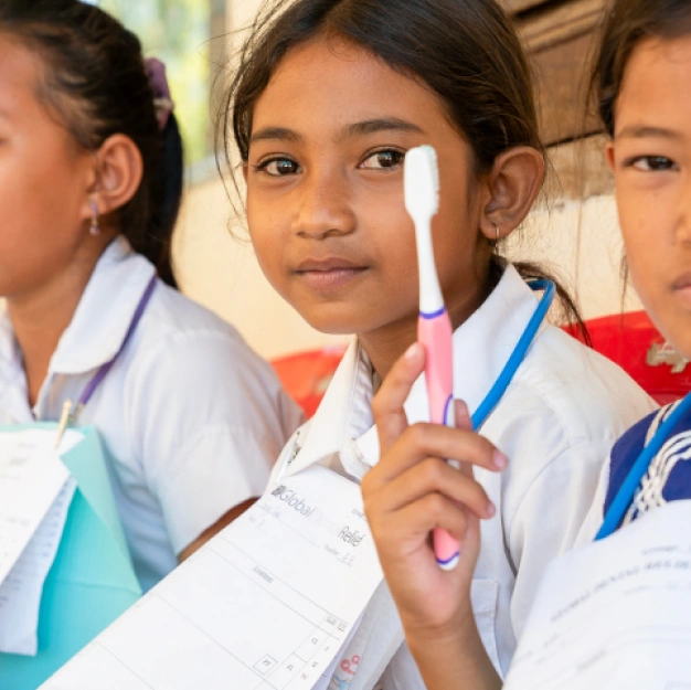 Global Dental Relief kids with toothbrushes