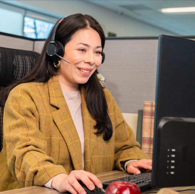 DentalQore employee talking to a client on the phone